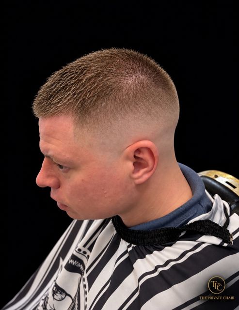 A high skin fade, from the front