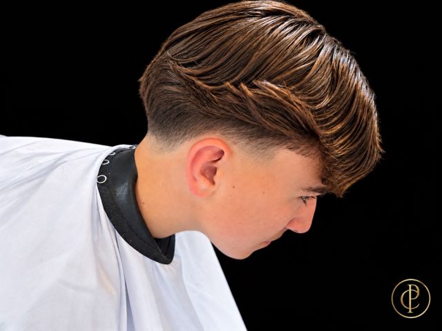A taper fade with a long, textured top